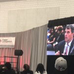 Investor Tim Draper questioning one of the pitch finalists.