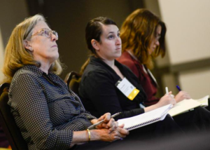 People listen to a panel at the SoVt Economy Summit