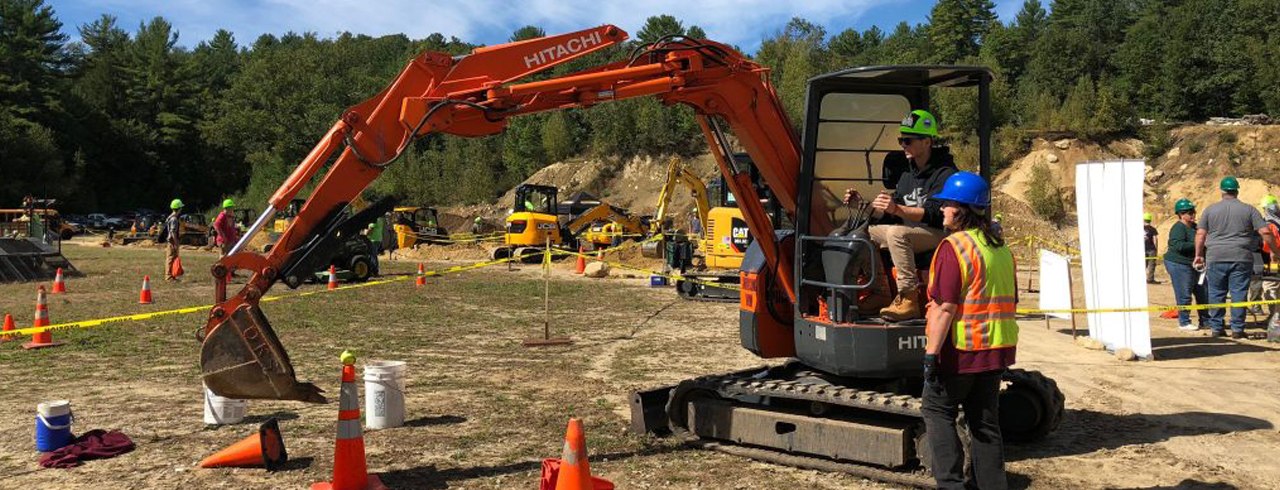 backhoe digging at job site
