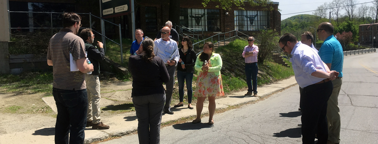 a group of people standing outside of a building