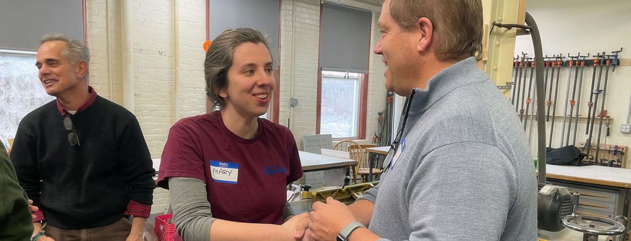 a man and woman speaking at an event