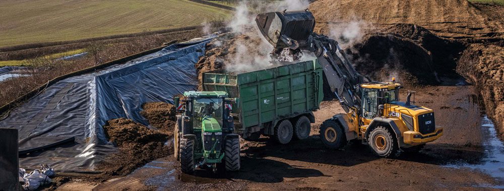 A bulldozer and dump truck on a work site