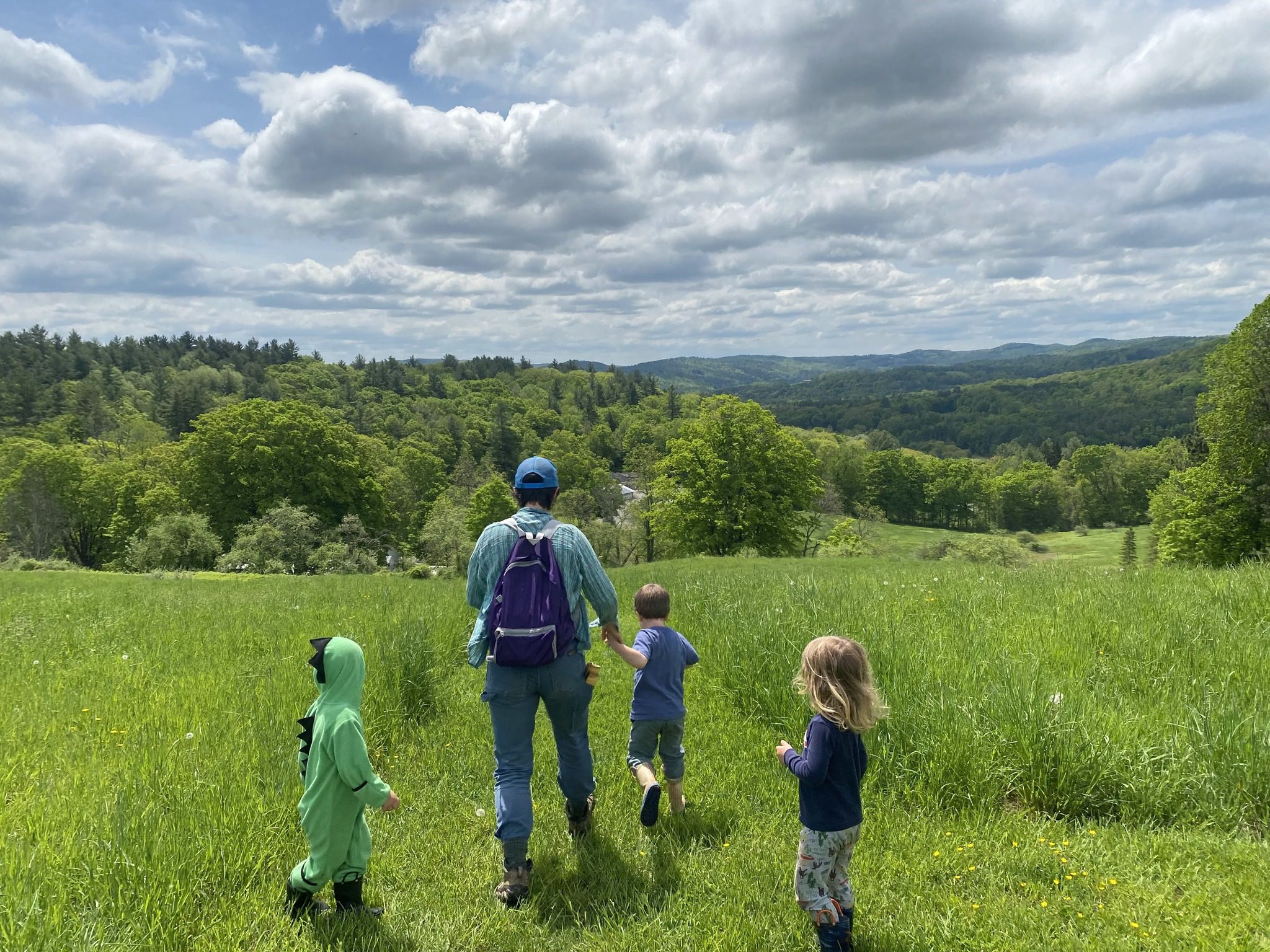 Adult with kids walking outside