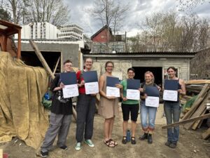 Class holding their certificates