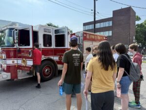 Students learning about a fire truck