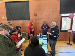 Students gathered around a table learning
